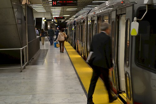 Boarding a MUNI Metro light rail train in the Market Street tunnel